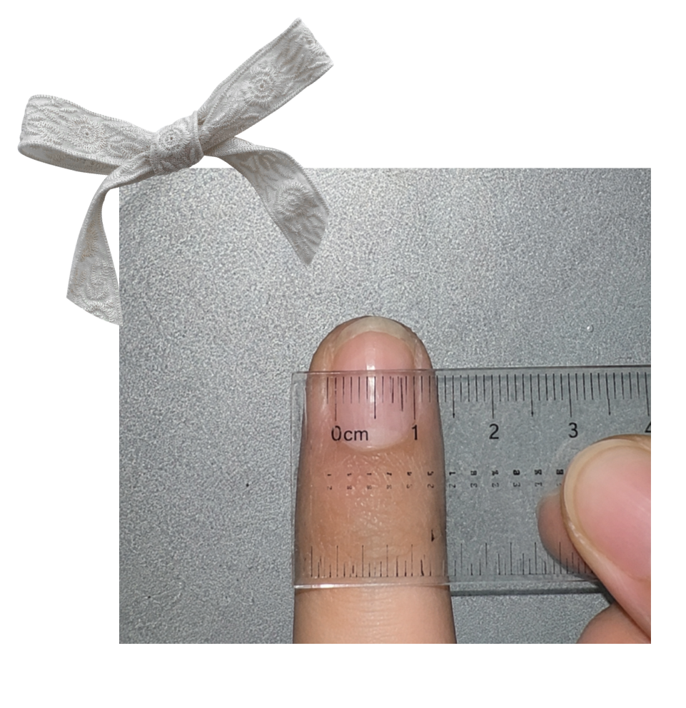 Fingernail measured across its widest point with a ruler